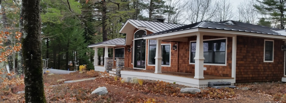 Exterior of a one-story home with metal roofing.